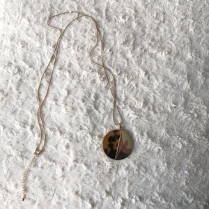 Gold and tortoise shell resin necklace